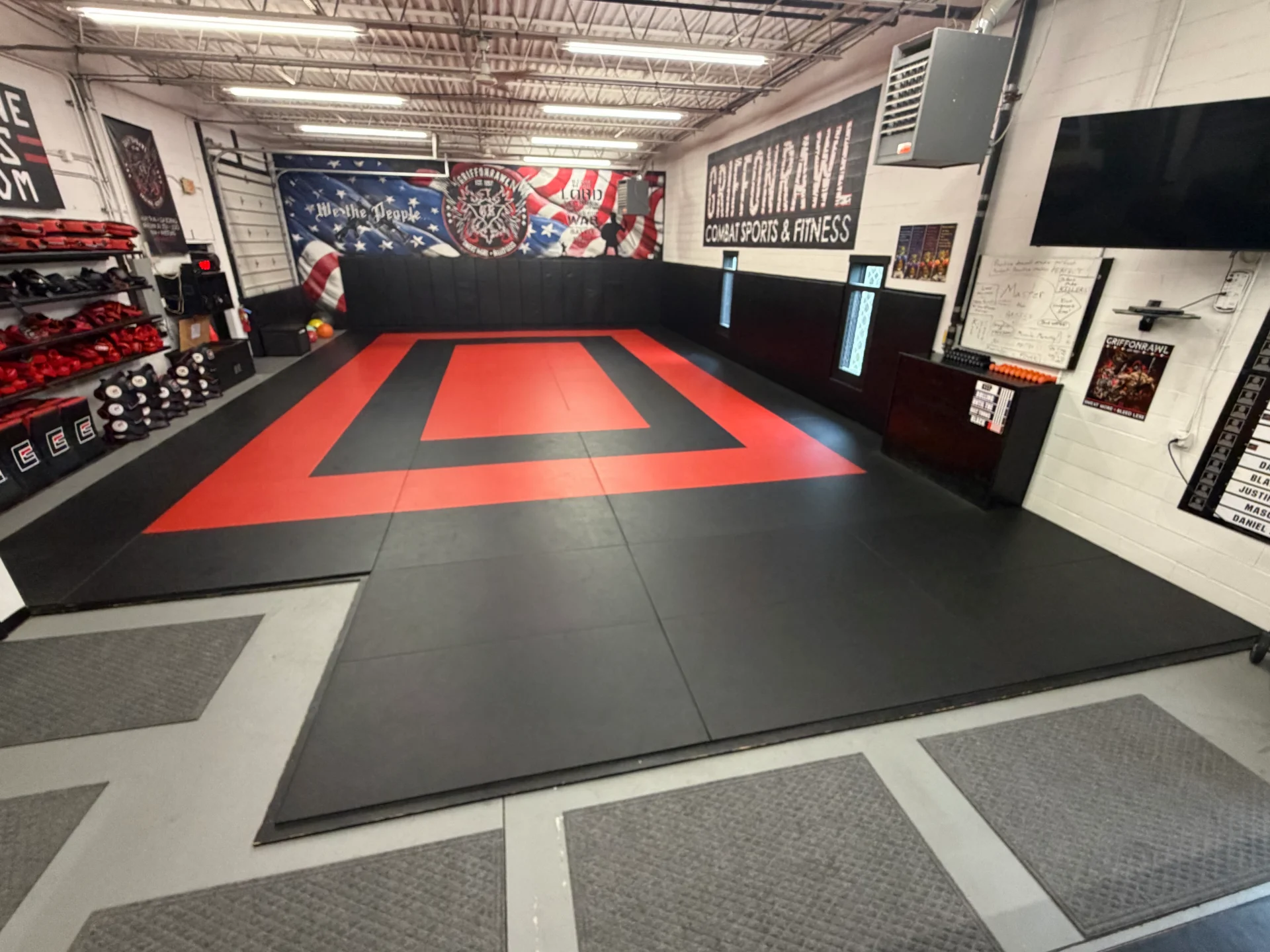 Martial arts gym with padded training area.