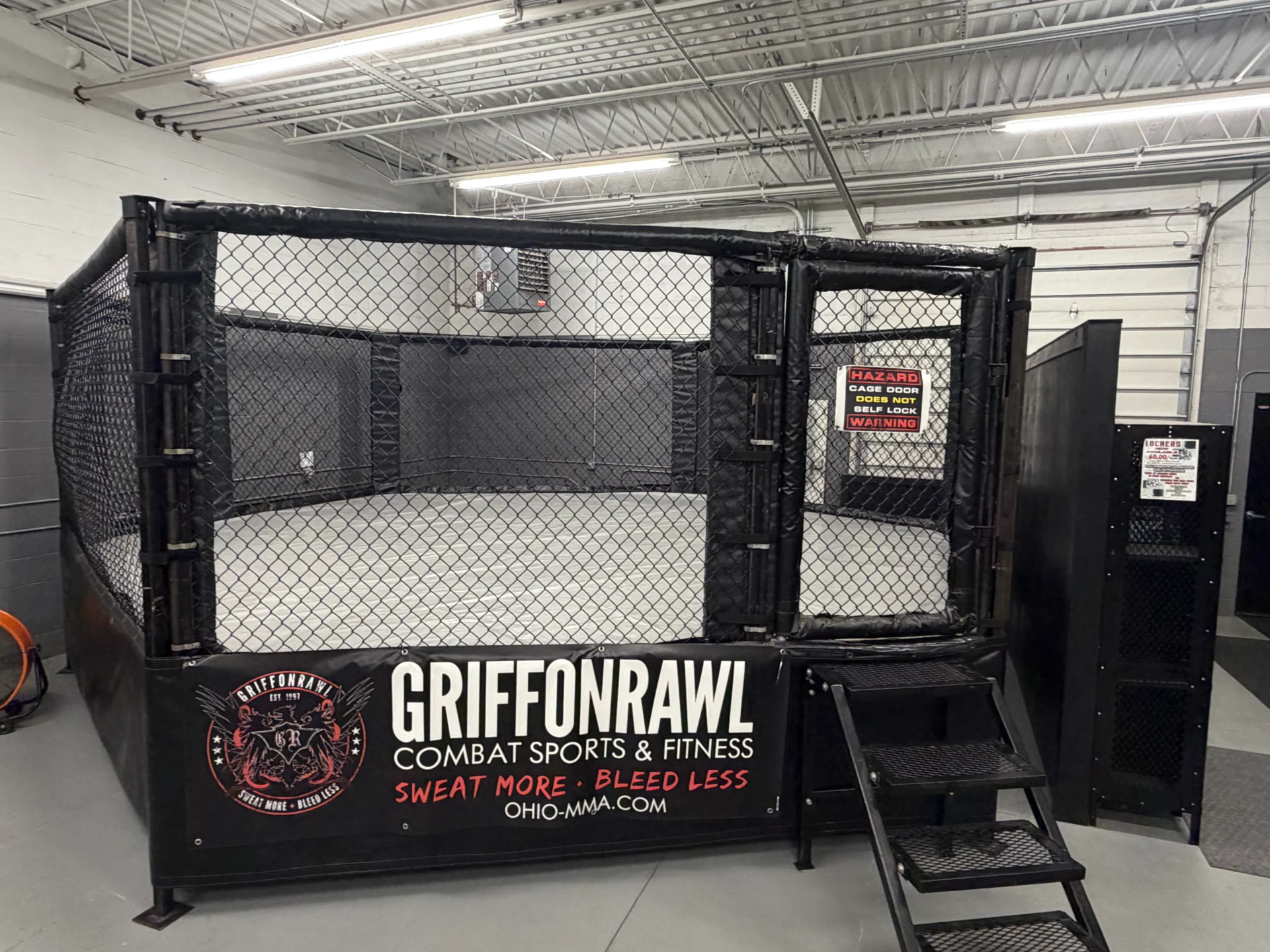 MMA cage at GriffonRawl Combat Sports facility.